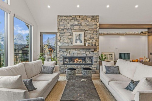 628 Silvertip Road, Canmore, AB - Indoor Photo Showing Living Room With Fireplace