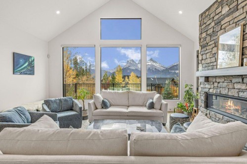 628 Silvertip Road, Canmore, AB - Indoor Photo Showing Living Room With Fireplace