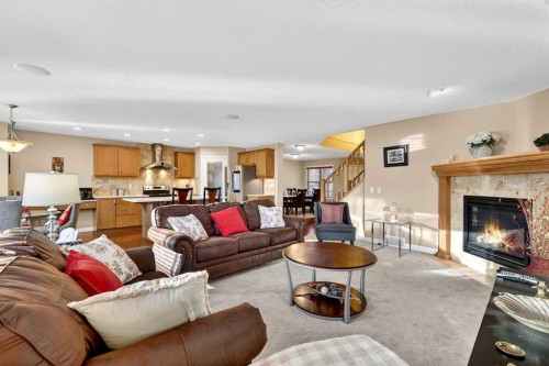 575 Everbrook Way Sw, Calgary, AB - Indoor Photo Showing Living Room With Fireplace