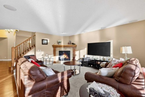 575 Everbrook Way Sw, Calgary, AB - Indoor Photo Showing Living Room With Fireplace
