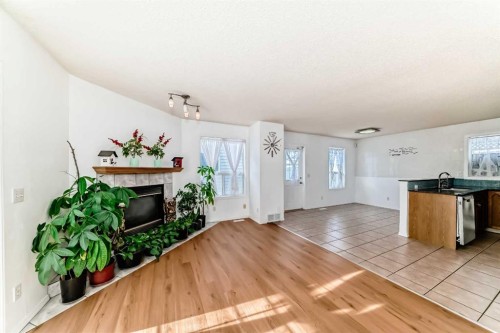 302 Applewood Drive Se, Calgary, AB - Indoor With Fireplace