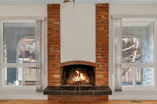 102 Huntham Place Ne, Calgary, AB - Indoor Photo Showing Living Room With Fireplace