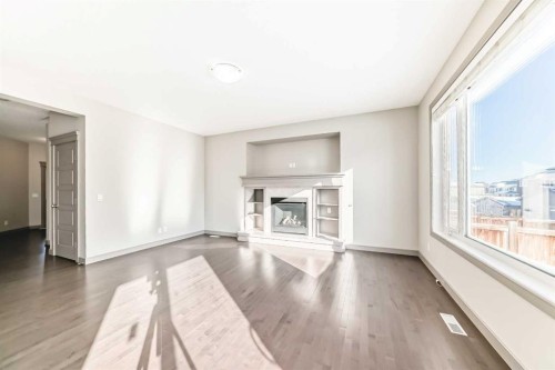 47 Evansglen Circle Nw, Calgary, AB - Indoor Photo Showing Living Room With Fireplace