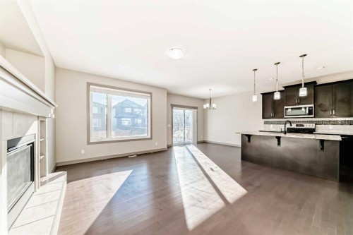 47 Evansglen Circle Nw, Calgary, AB - Indoor Photo Showing Kitchen With Fireplace