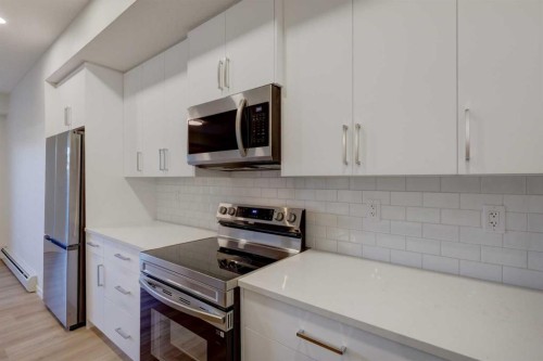 118-245 Edith Place Nw, Calgary, AB - Indoor Photo Showing Kitchen