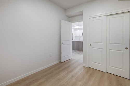 118-245 Edith Place Nw, Calgary, AB - Indoor Photo Showing Other Room