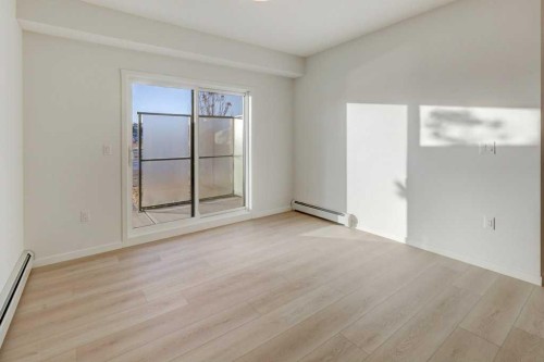 124-245 Edith Place Nw, Calgary, AB - Indoor Photo Showing Other Room