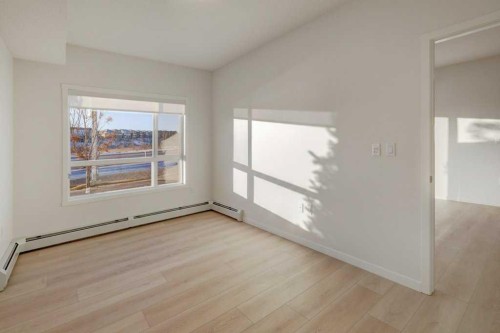 124-245 Edith Place Nw, Calgary, AB - Indoor Photo Showing Other Room