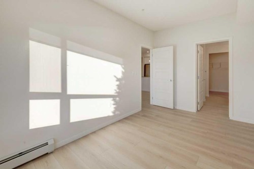 124-245 Edith Place Nw, Calgary, AB - Indoor Photo Showing Other Room