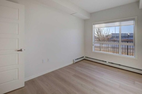 124-245 Edith Place Nw, Calgary, AB - Indoor Photo Showing Other Room