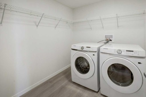 308-245 Edith Place Nw, Calgary, AB - Indoor Photo Showing Laundry Room