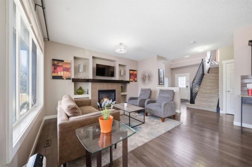 639 Copperpond Circle Se, Calgary, AB - Indoor Photo Showing Living Room With Fireplace