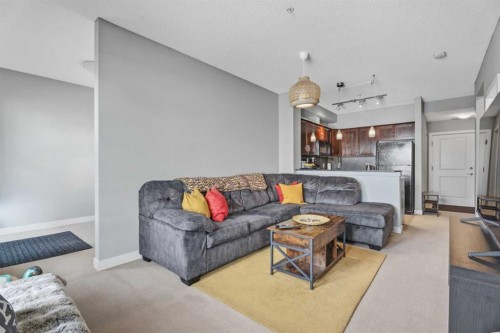 320-201 Sunset Drive, Cochrane, AB - Indoor Photo Showing Living Room