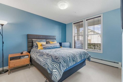 320-201 Sunset Drive, Cochrane, AB - Indoor Photo Showing Bedroom