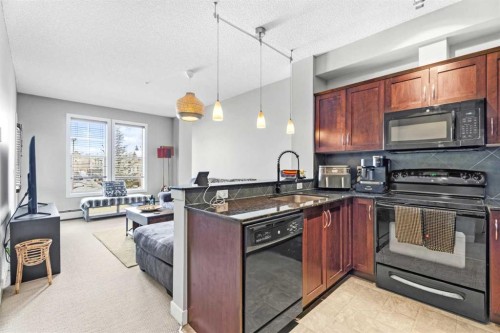 320-201 Sunset Drive, Cochrane, AB - Indoor Photo Showing Kitchen