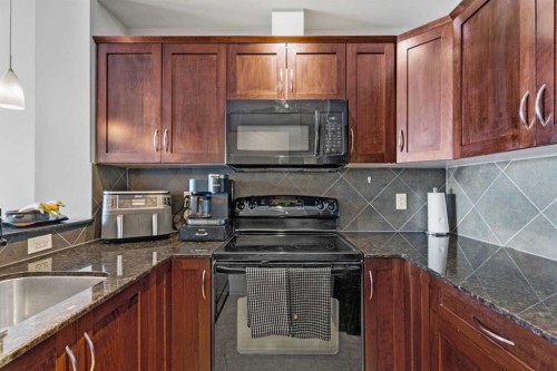 320-201 Sunset Drive, Cochrane, AB - Indoor Photo Showing Kitchen