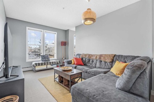 320-201 Sunset Drive, Cochrane, AB - Indoor Photo Showing Living Room