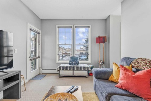 320-201 Sunset Drive, Cochrane, AB - Indoor Photo Showing Living Room