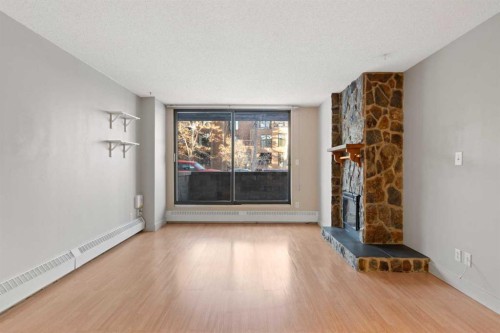 105-345 4 Avenue Ne, Calgary, AB - Indoor With Fireplace