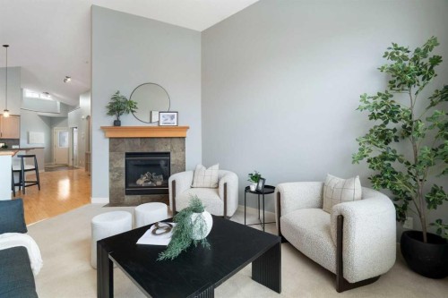 264 Windermere Drive, Chestermere, AB - Indoor Photo Showing Living Room With Fireplace
