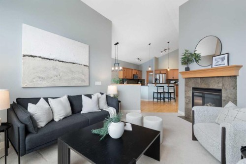 264 Windermere Drive, Chestermere, AB - Indoor Photo Showing Living Room With Fireplace