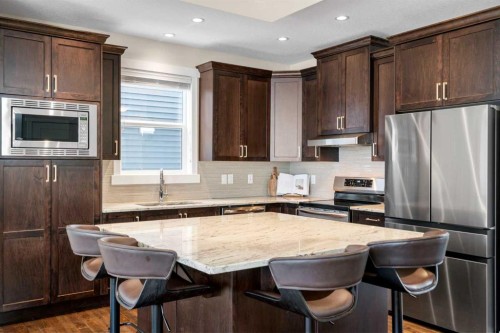 346 Cooperstown Common Sw, Airdrie, AB - Indoor Photo Showing Kitchen With Upgraded Kitchen