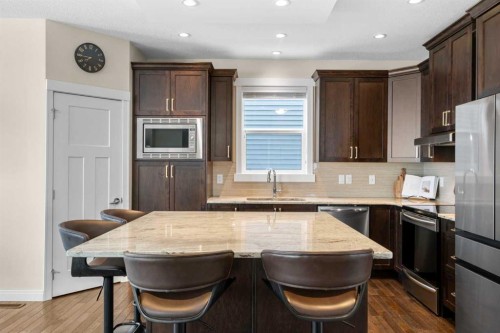 346 Cooperstown Common Sw, Airdrie, AB - Indoor Photo Showing Kitchen With Double Sink With Upgraded Kitchen