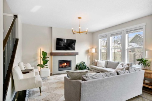 346 Cooperstown Common Sw, Airdrie, AB - Indoor Photo Showing Living Room With Fireplace