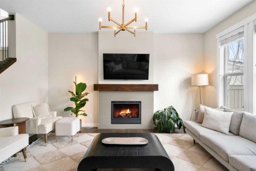 346 Cooperstown Common Sw, Airdrie, AB - Indoor Photo Showing Living Room With Fireplace