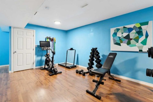124 Cascades Pass, Chestermere, AB - Indoor Photo Showing Gym Room