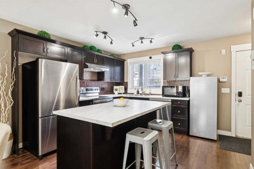 124 Cascades Pass, Chestermere, AB - Indoor Photo Showing Kitchen With Stainless Steel Kitchen