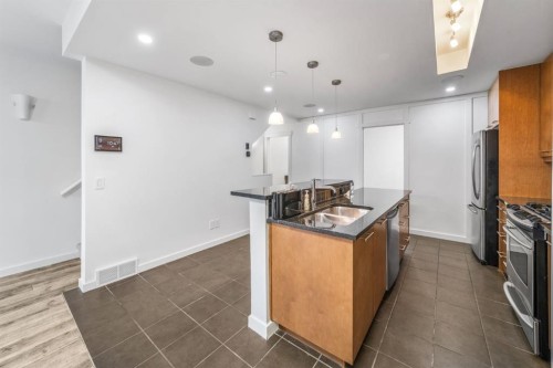 156 9 Street Ne, Calgary, AB - Indoor Photo Showing Kitchen With Double Sink