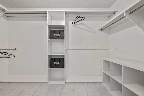 162 Woodbend Way, Okotoks, AB - Indoor With Storage