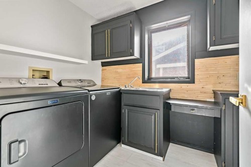 162 Woodbend Way, Okotoks, AB - Indoor Photo Showing Laundry Room