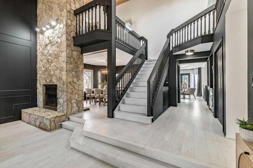 162 Woodbend Way, Okotoks, AB - Indoor With Fireplace