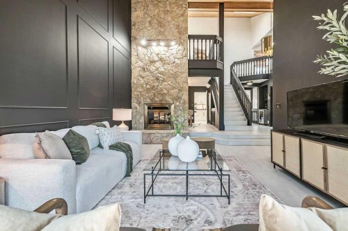 162 Woodbend Way, Okotoks, AB - Indoor Photo Showing Living Room With Fireplace