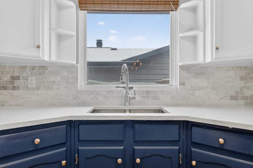 139 Hodson Crescent, Okotoks, AB - Indoor Photo Showing Kitchen With Double Sink