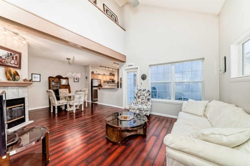 1906 Patterson View Sw, Calgary, AB - Indoor Photo Showing Living Room With Fireplace