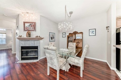 1906 Patterson View Sw, Calgary, AB - Indoor Photo Showing Dining Room With Fireplace