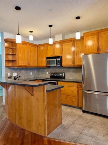 1108-24 Hemlock Crescent Sw, Calgary, AB - Indoor Photo Showing Kitchen With Stainless Steel Kitchen