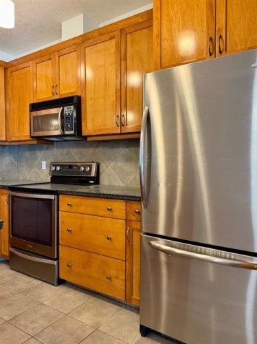 1108-24 Hemlock Crescent Sw, Calgary, AB - Indoor Photo Showing Kitchen With Stainless Steel Kitchen