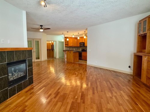 1108-24 Hemlock Crescent Sw, Calgary, AB - Indoor Photo Showing Living Room With Fireplace