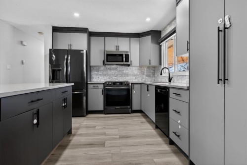 255 Rundleridge Drive Ne, Calgary, AB - Indoor Photo Showing Kitchen With Upgraded Kitchen