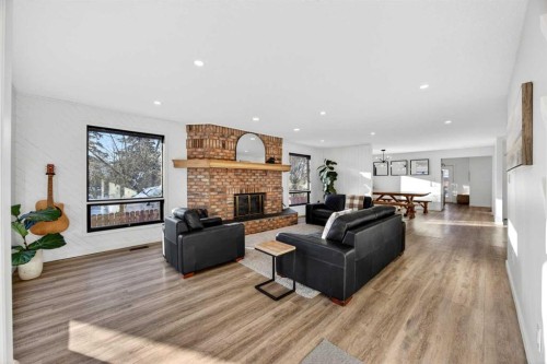 7103 Bow Crescent Nw, Calgary, AB - Indoor Photo Showing Living Room With Fireplace