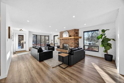 7103 Bow Crescent Nw, Calgary, AB - Indoor Photo Showing Living Room With Fireplace