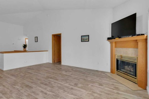119 Edgepark Villas Nw, Calgary, AB - Indoor With Fireplace