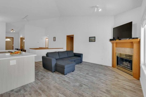 119 Edgepark Villas Nw, Calgary, AB - Indoor Photo Showing Living Room With Fireplace