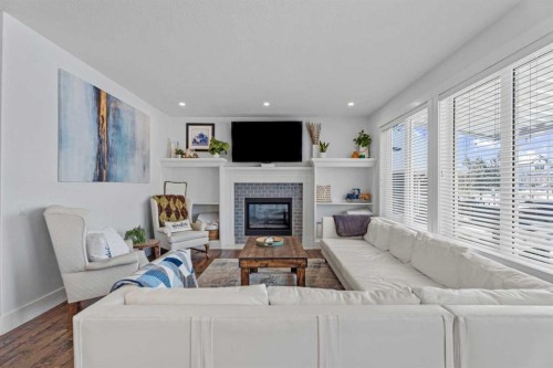 5 Cimarron Springs Circle, Okotoks, AB - Indoor Photo Showing Other Room With Fireplace