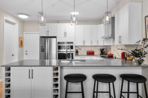 607-11 Mahogany Circle Se, Calgary, AB - Indoor Photo Showing Kitchen With Upgraded Kitchen