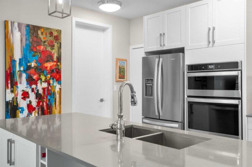 607-11 Mahogany Circle Se, Calgary, AB - Indoor Photo Showing Kitchen With Double Sink With Upgraded Kitchen